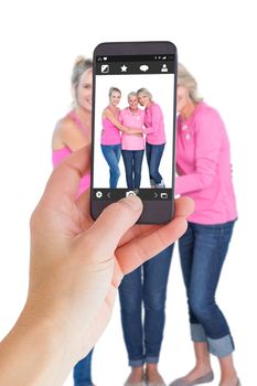 Female hand holding a smartphone against camera