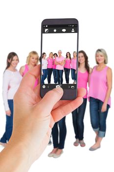 Female hand holding a smartphone against camera