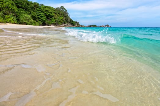 Beautiful landscape blue sea white sand and waves on the beach during summer at Koh Miang island in Mu Ko Similan National Park, Phang Nga province, Thailand