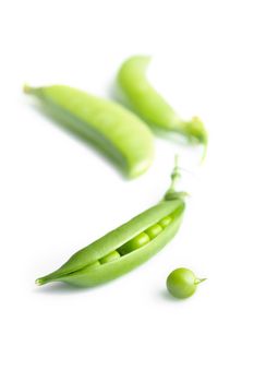 Fresh peas isolated on white background