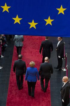 FRANCE, Strasbourg: German Chancellor Angela Merkel (c), French President Francois Hollande (L) and President of the European Parliament Martin Schulz (R) are pictured as they arrive at the European Parliament on October 7, 2015 in Strasbourg, eastern France. Angela Merkel and Francois Hollande are set to give a joint address, the first such event by leaders of the two countries since 1989. Merkel and Hollande, the leaders of the European Union's two biggest economies, have played a driving role in a series of challenges that have gripped the 28-nation bloc, ranging from the migrant crisis to the Greek debt saga and the conflict in Ukraine. Failure to act in Syria risks stoking a total war in the Middle East, Francois Hollande said in a landmark speech to the European Parliament alongside Angela Merkel.