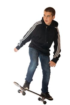 The photo depicts a boy on a skateboard