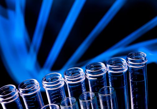 detail of the test tubes in laboratory on blue light tint background