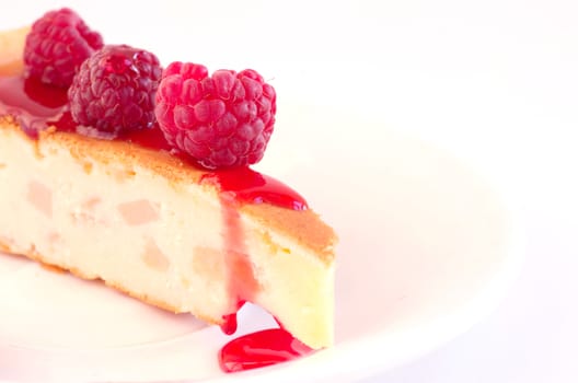 cake with raspberries and cream cheese decorated with fresh raspberries and mint. the toning. selective focus