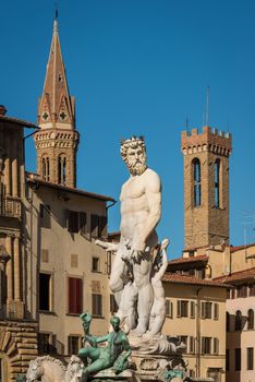 Statue of Neptune with towers in background, Piazza della Signoria, Florence (Italy)