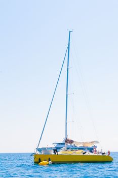 yellow sailboat sailing sail blue Mediterranean sea ocean horizon
