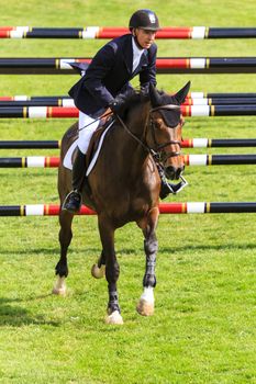 CALGARY CANADA - JUN 7 2015   Unidentified rider in action during the prestige s Spruce Meadows International hors jumping competition,  riders comes all over the world to compete.