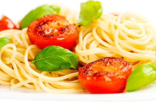 Traditional italian macaroni pasta with grilled tomato and oregano