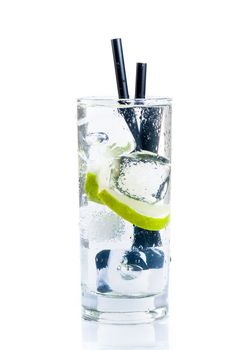 Cocktail with ice and lime slice isolated on white background