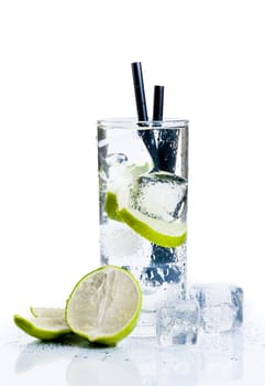 Cocktail with ice and lime slice isolated on white background