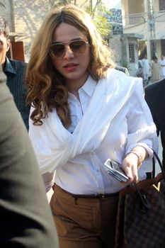 PAKISTAN, Rawalpindi: Singer and model Ayyan Ali walks to a court hearing in Rawalpindi, Pakistan, on October 8, 2015. 	Ali was charged with money laundering�after security forces found over $500,000 in her luggage on a flight destined for Dubai in March. 