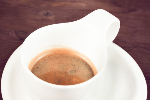 italian espresso coffee cup top view on old wooden, old style