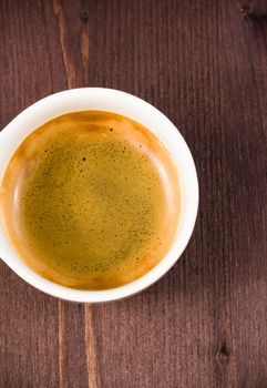 italian espresso coffee cup top view on old wooden