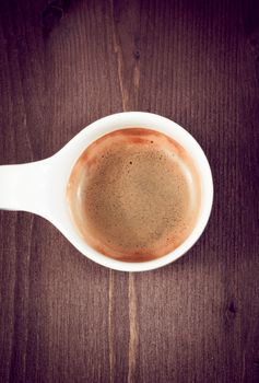 italian espresso coffee cup top view on old wooden, old style