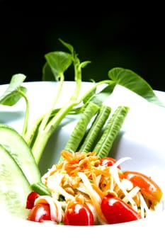 som tum thai served in white plate