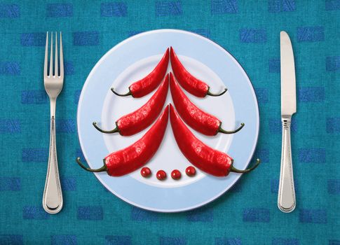 Christmas dish on white plate with knife and fork