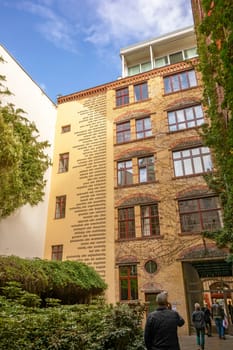 Berlin, Germany - October 26, 2013: Facade of one of the eight yards called "Hackesche Hoefe" in the district Spandauer Vorstadt. They was refurbished in 1993 and host today several shopping malls, galleries and restaurants.