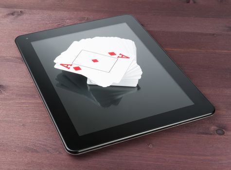 deck of playing cards on digital tablet pc on old wood table, concept of  texas poker online