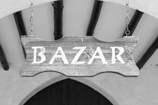 Wood sign at the entrance of an arab market.