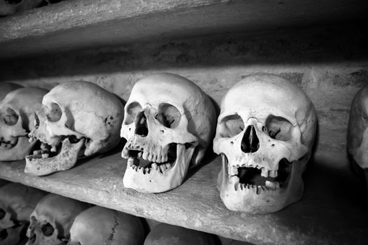 human skulls inside a Christian catacomb in Italy
