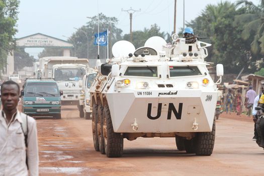 CENTRAL AFRICAN REPUBLIC, Bangui : Vehicles of the United Nations Multidimensional Stabilization Mission in Central African Republic, Minusca, passe on a street in Bangui, as it patrols in the city, on October 8, 2015. The Central African Republic descended into bloodshed more than two years ago after long time president Francois Bozize, a Christian, was ousted by Seleka rebels, triggering the worst crisis since independence in 1960. On September 29, 2015, Bangui returned to only relative calm after three days of inter-community violence which left at least 40 dead and 100 injured according to the UN Refugee Agency UNHCR. Some 27,000 inhabitants of Bangui have also fled to displaced people's camps. 