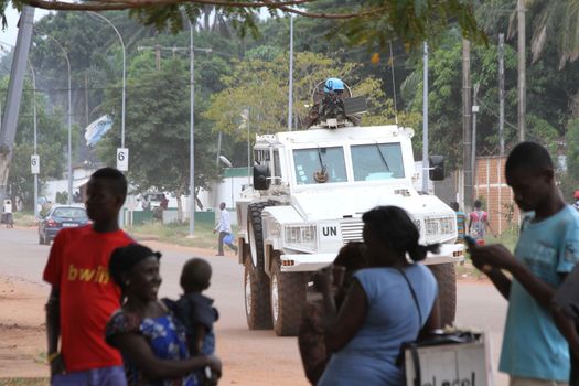 CENTRAL AFRICAN REPUBLIC, Bangui : Vehicles of the United Nations Multidimensional Stabilization Mission in Central African Republic, Minusca, passe on a street in Bangui, as it patrols in the city, on October 8, 2015. The Central African Republic descended into bloodshed more than two years ago after long time president Francois Bozize, a Christian, was ousted by Seleka rebels, triggering the worst crisis since independence in 1960. On September 29, 2015, Bangui returned to only relative calm after three days of inter-community violence which left at least 40 dead and 100 injured according to the UN Refugee Agency UNHCR. Some 27,000 inhabitants of Bangui have also fled to displaced people's camps. 