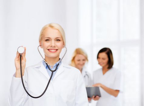 healthcare and medicine concept - smiling female doctor with stethoscope