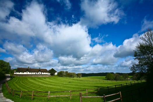 Landscape with old farm in spring in Denmark