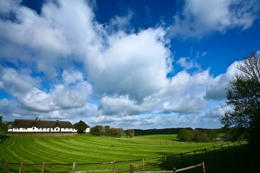 Landscape with old farm in spring in Denmark