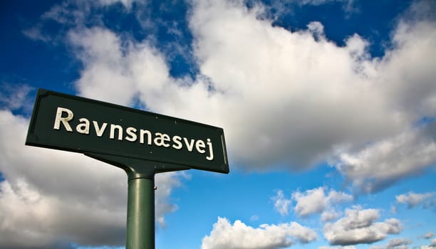 Ravnnaesvej sign and blue sky in denmark