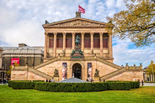 Berlin, Germany - October 26, 2013: Exterior view of Alte Nationalgalerie (Old National Gallery) on the Museumsinsel in Berlin-Mitte. The Pergamon museum on the left in the background.