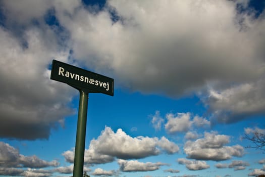 Ravnnaesvej sign and blue sky in denmark