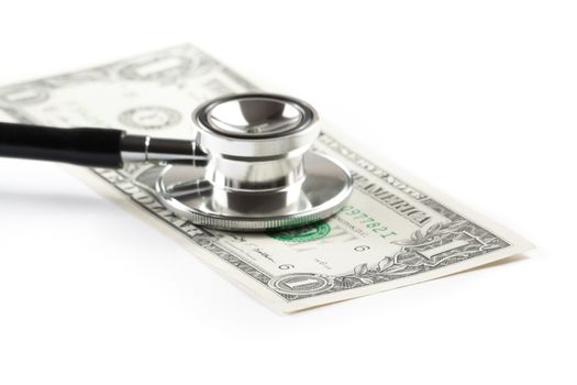 stethoscope on one dollar under white background, cost of medical health care