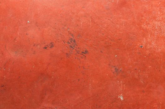 Old red cement wall with scratch