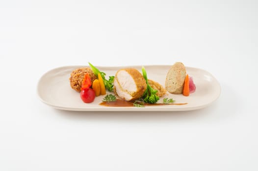 3 modern cuisine Prosciutto Wrapped Chicken with resotto and tamarind sauce, Fried mussaman curry, and Thai chicken spicy sausage on ceramic dish garnished with vegetables