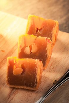 Moon cake, Chinese mid autumn festival dessert on wood board with dramatic morning scene