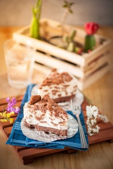 Chocolate cookie cheese cake on wood table with vintage scene in morning