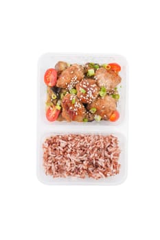 Tsukune (Japanese chicken meatballs) cooked by clean food concept with brown rice in lunch box on white table isolated on white background