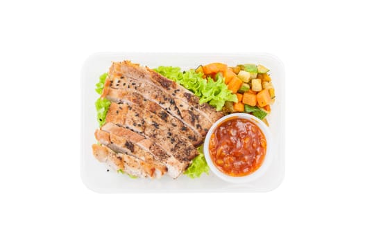 Roasted pork with three flavoured (sweet, sour, spicy) sauce cooked by clean food concept with vegetables in lunch box isolated on white background