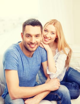 love, family and happiness concept - smiling happy couple at home