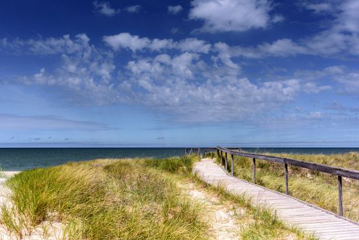 Wooden pier on the empty beach