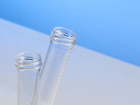 test tubes in laboratory on table and blue background