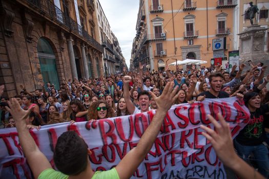 ITALY, Palermo: Thousands of students marched and held banners against Renzi's school reform in Palermo, Italy on October 9, 2015.A theme of the protests is the revisions to the calculation of family income, which some say will reduce scholarships and housing for students. Students throughout the country protested what's know as La Buona Scuola.  A spokesman for the protesters said they were going to announce a week of mobilization lasting until October 17. They plan to launch an attack for free education and reversal of policies. 