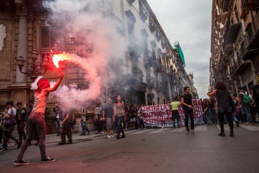 ITALY, Palermo: Thousands of students marched and held banners against Renzi's school reform in Palermo, Italy on October 9, 2015.A theme of the protests is the revisions to the calculation of family income, which some say will reduce scholarships and housing for students. Students throughout the country protested what's know as La Buona Scuola.  A spokesman for the protesters said they were going to announce a week of mobilization lasting until October 17. They plan to launch an attack for free education and reversal of policies. 