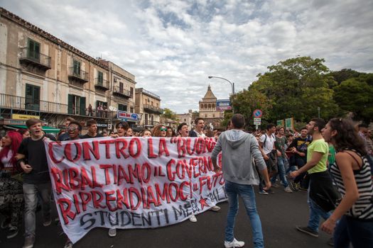 ITALY, Palermo: Thousands of students marched and held banners against Renzi's school reform in Palermo, Italy on October 9, 2015.A theme of the protests is the revisions to the calculation of family income, which some say will reduce scholarships and housing for students. Students throughout the country protested what's know as La Buona Scuola.  A spokesman for the protesters said they were going to announce a week of mobilization lasting until October 17. They plan to launch an attack for free education and reversal of policies. 