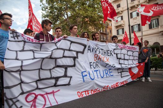 ITALY, Palermo: Thousands of students marched and held banners against Renzi's school reform in Palermo, Italy on October 9, 2015.A theme of the protests is the revisions to the calculation of family income, which some say will reduce scholarships and housing for students. Students throughout the country protested what's know as La Buona Scuola.  A spokesman for the protesters said they were going to announce a week of mobilization lasting until October 17. They plan to launch an attack for free education and reversal of policies. 