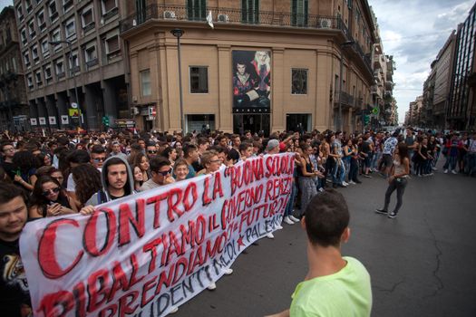 ITALY, Palermo: Thousands of students marched and held banners against Renzi's school reform in Palermo, Italy on October 9, 2015.A theme of the protests is the revisions to the calculation of family income, which some say will reduce scholarships and housing for students. Students throughout the country protested what's know as La Buona Scuola.  A spokesman for the protesters said they were going to announce a week of mobilization lasting until October 17. They plan to launch an attack for free education and reversal of policies. 