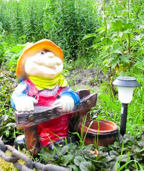 figure gnome in the garden on the green grass