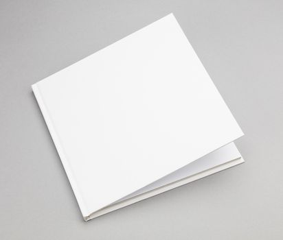 Blank book with ajar white cover