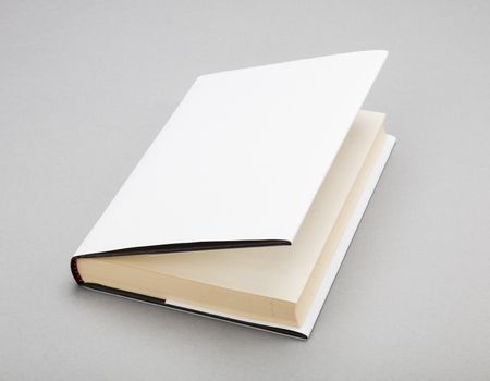 Blank book with ajar white cover